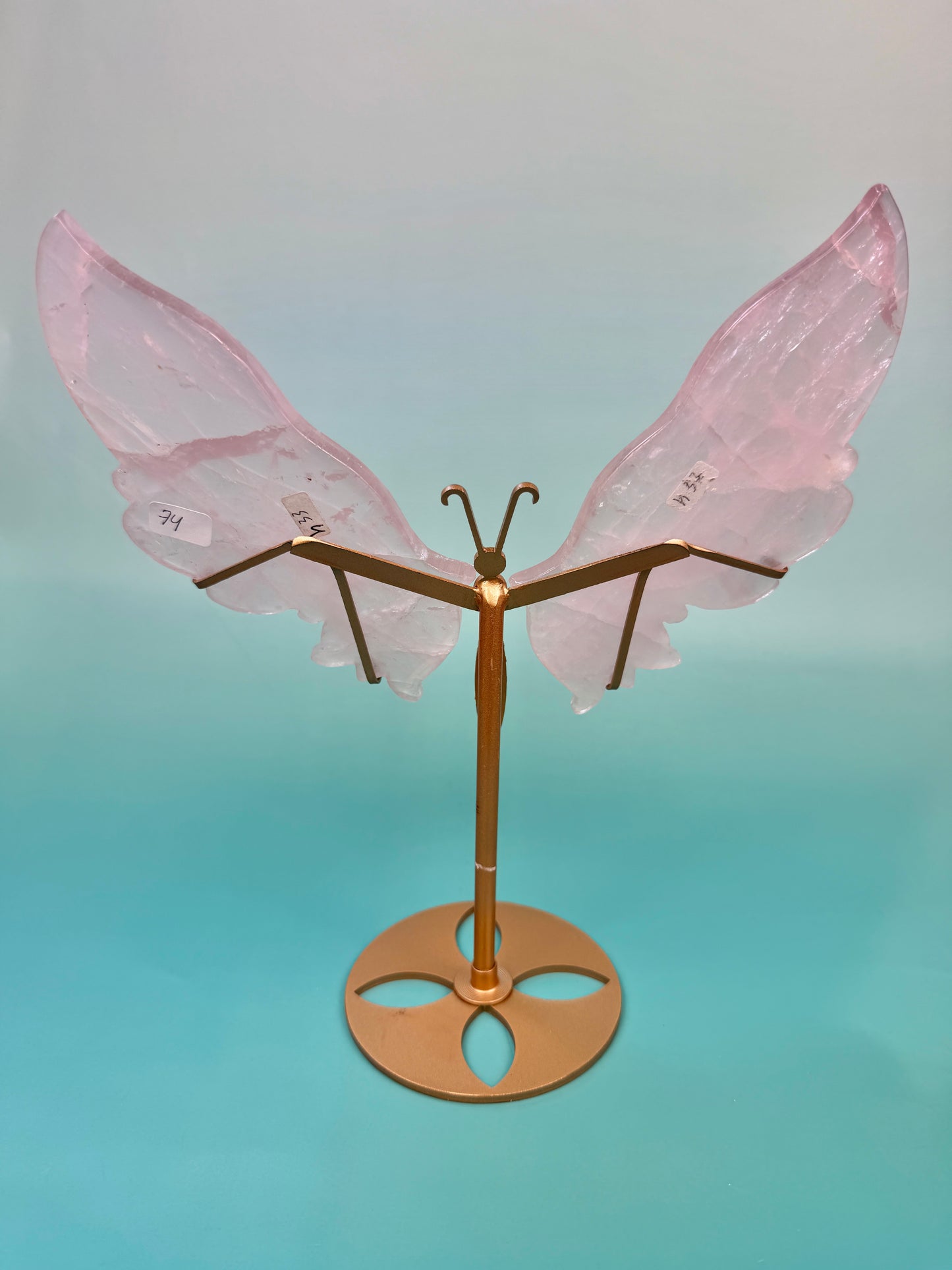 Beautiful rose quartz butterfly on gold stand