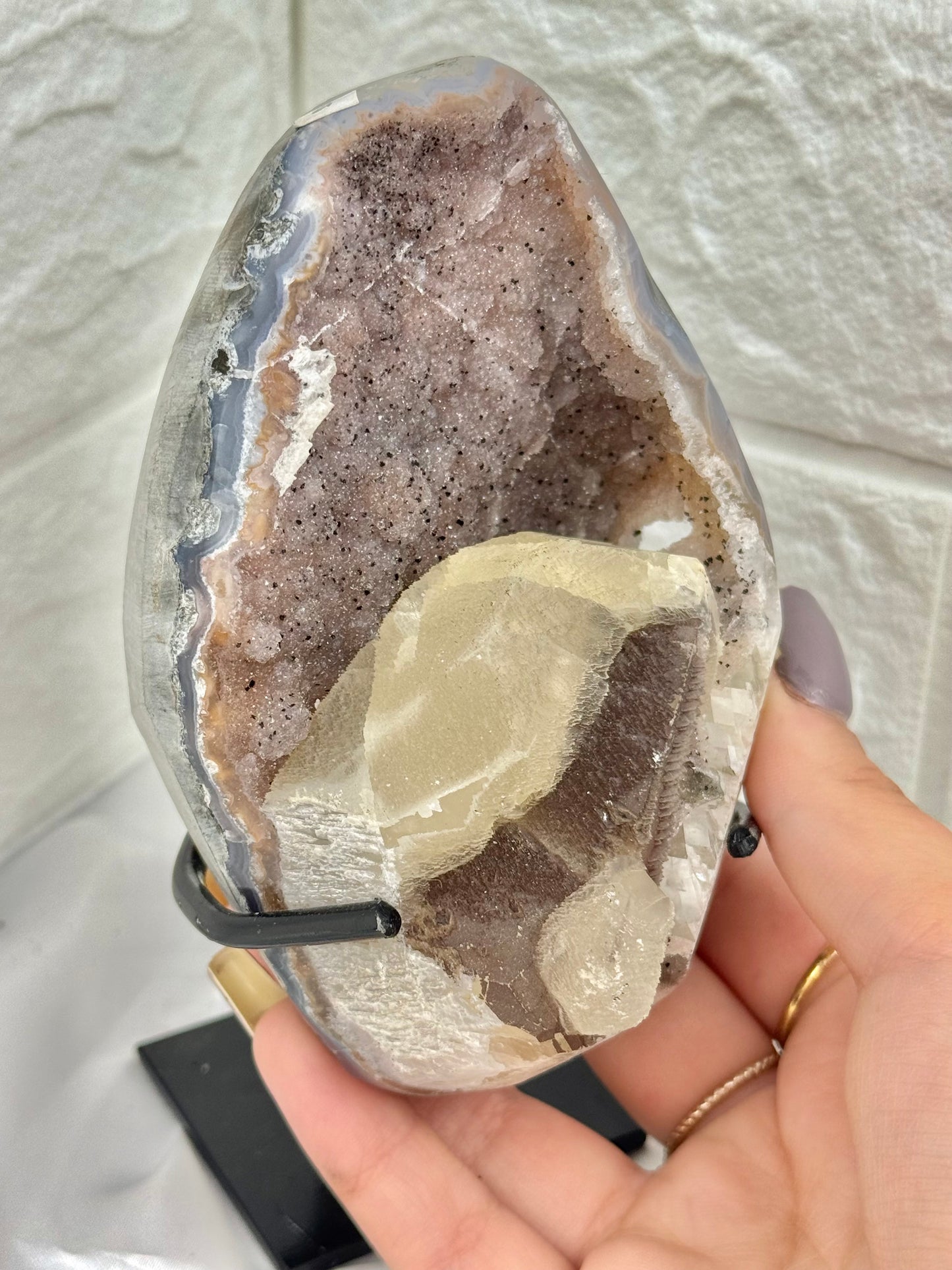 Pink amethyst with calcite on stand from Brazil
