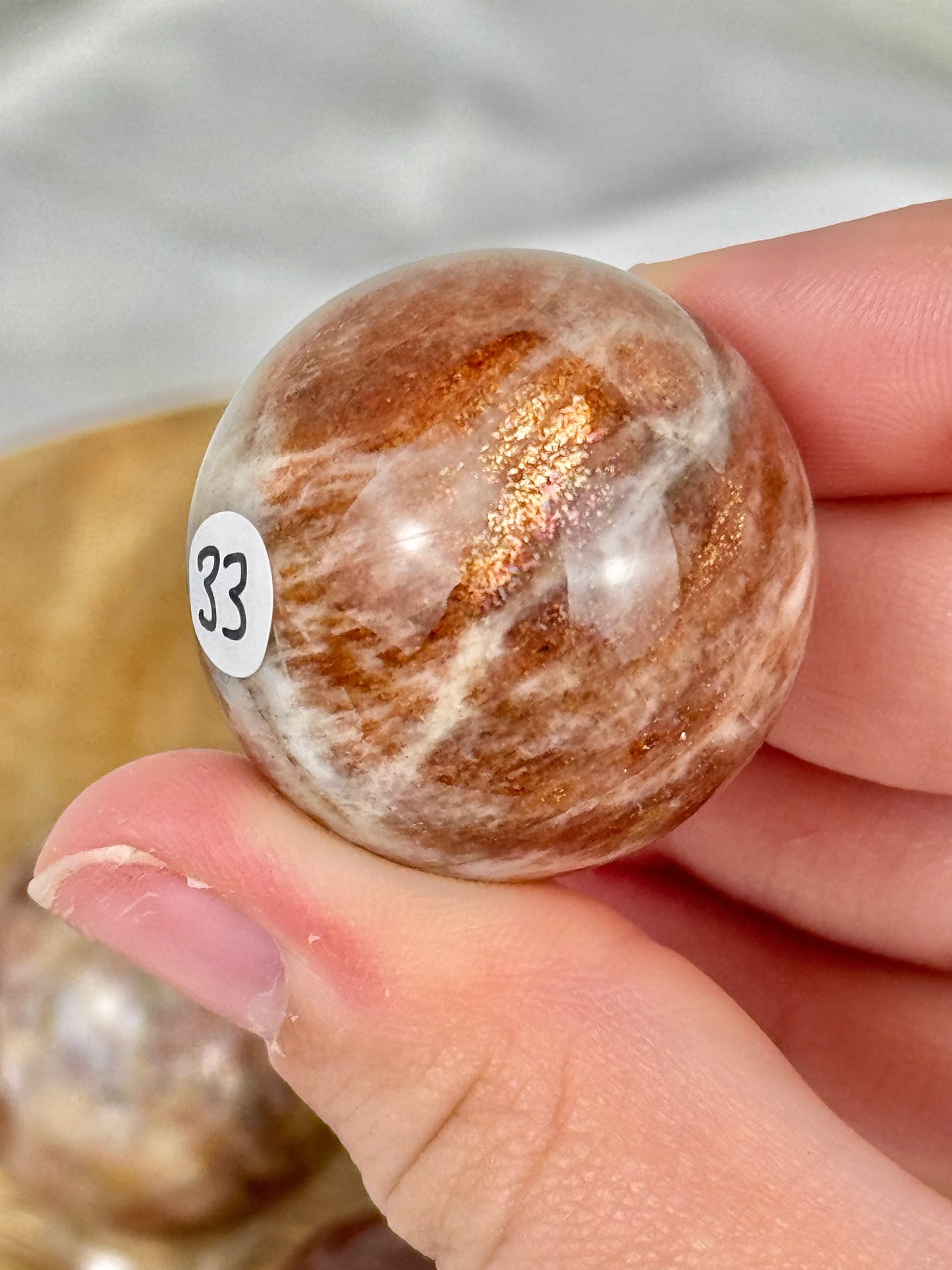 1 flashy sunstone x moonstone sphere from Tanzania