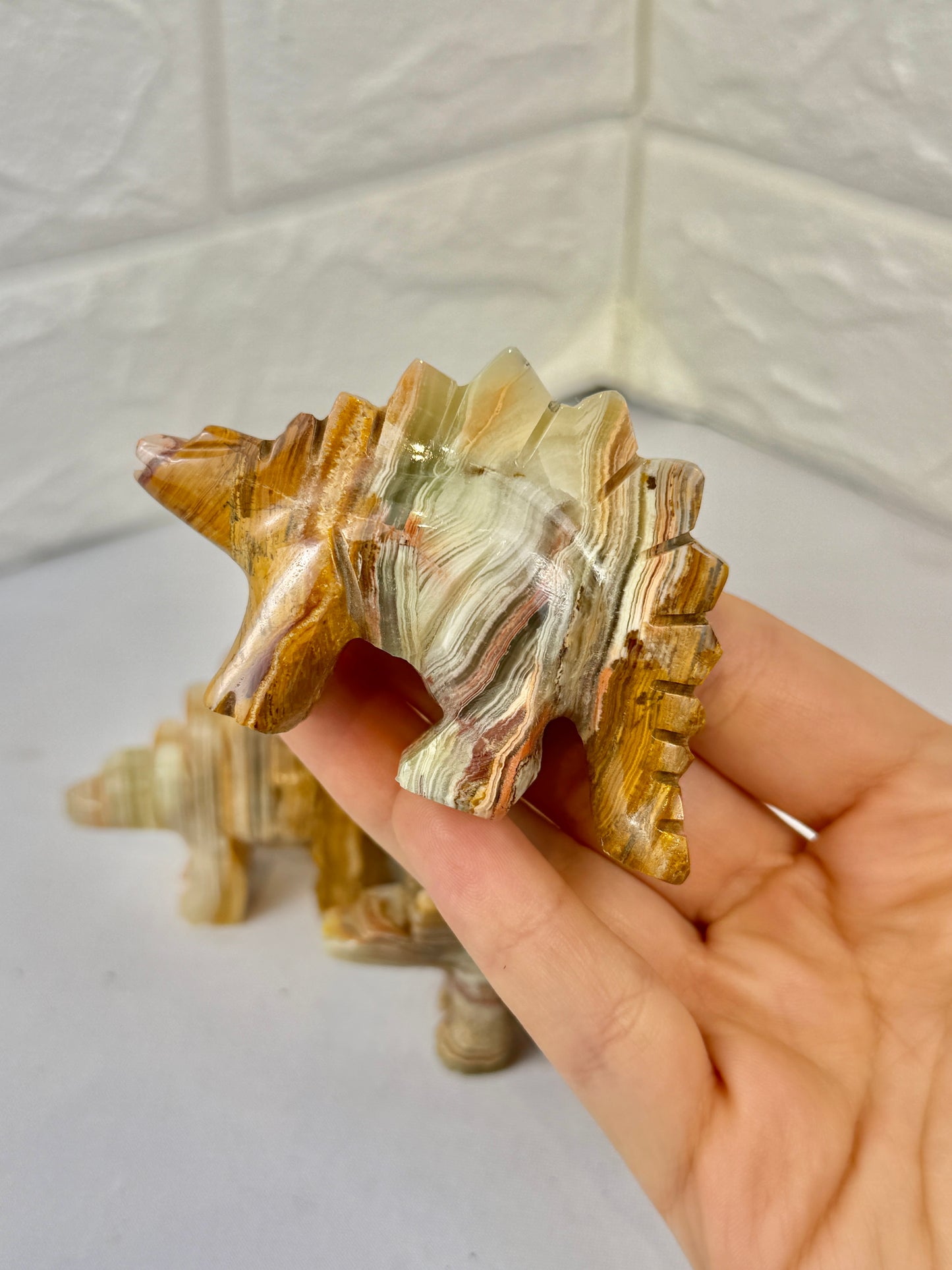 1 green calcite stegosaurus carving
