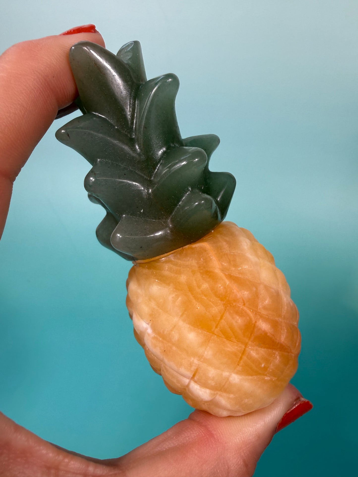 1 Orange calcite, green aventurine pineapple carving