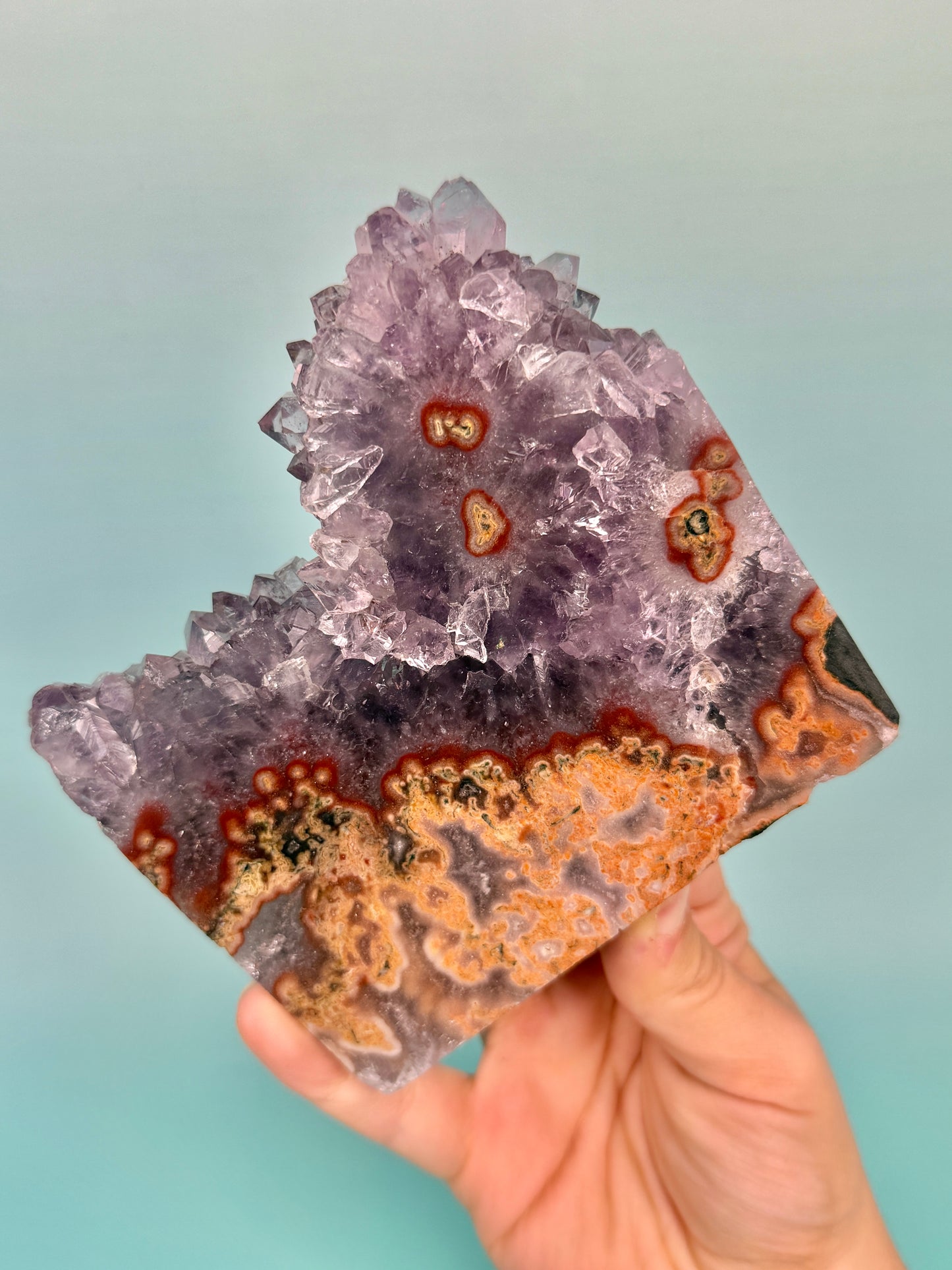 Stunning purple amethyst stalactite slab with peach jasper on stand from Uruguay