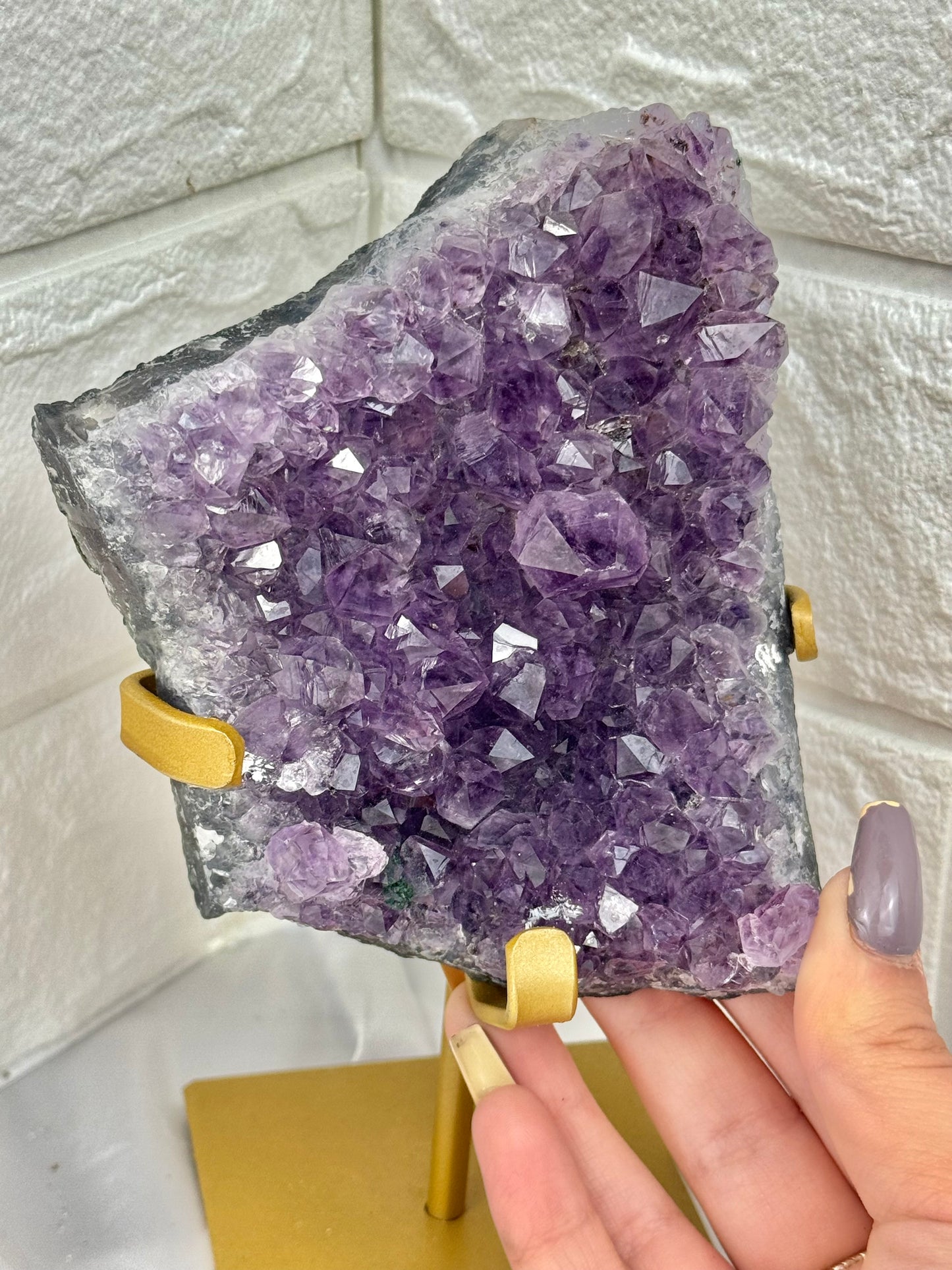 Beautiful amethyst on gold stand from Brazil