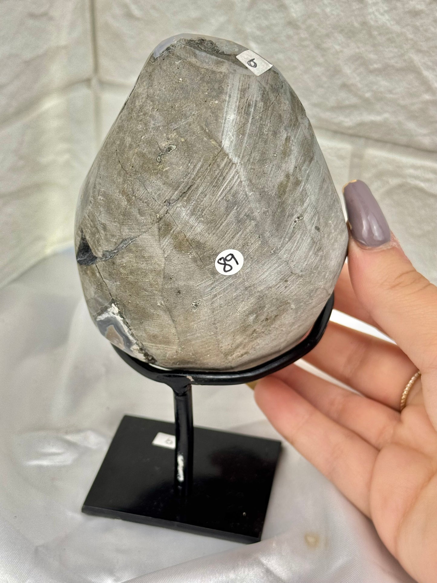 Pink amethyst with calcite on stand from Brazil