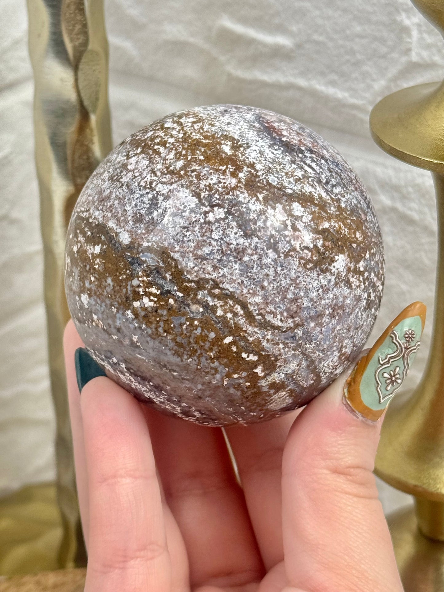 Purple/brown sea jasper sphere