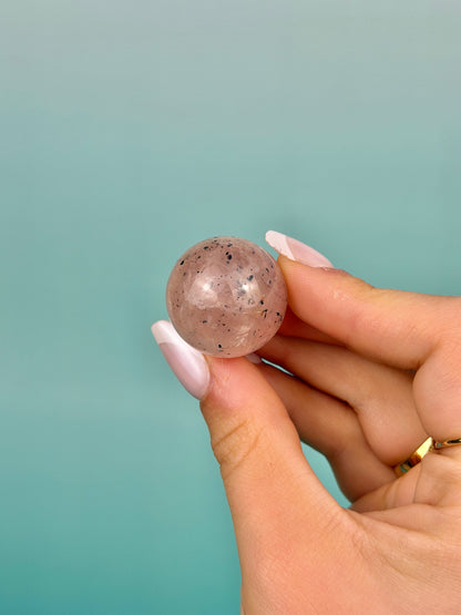 Hematite included flashy rose quartz mini sphere from Brazil