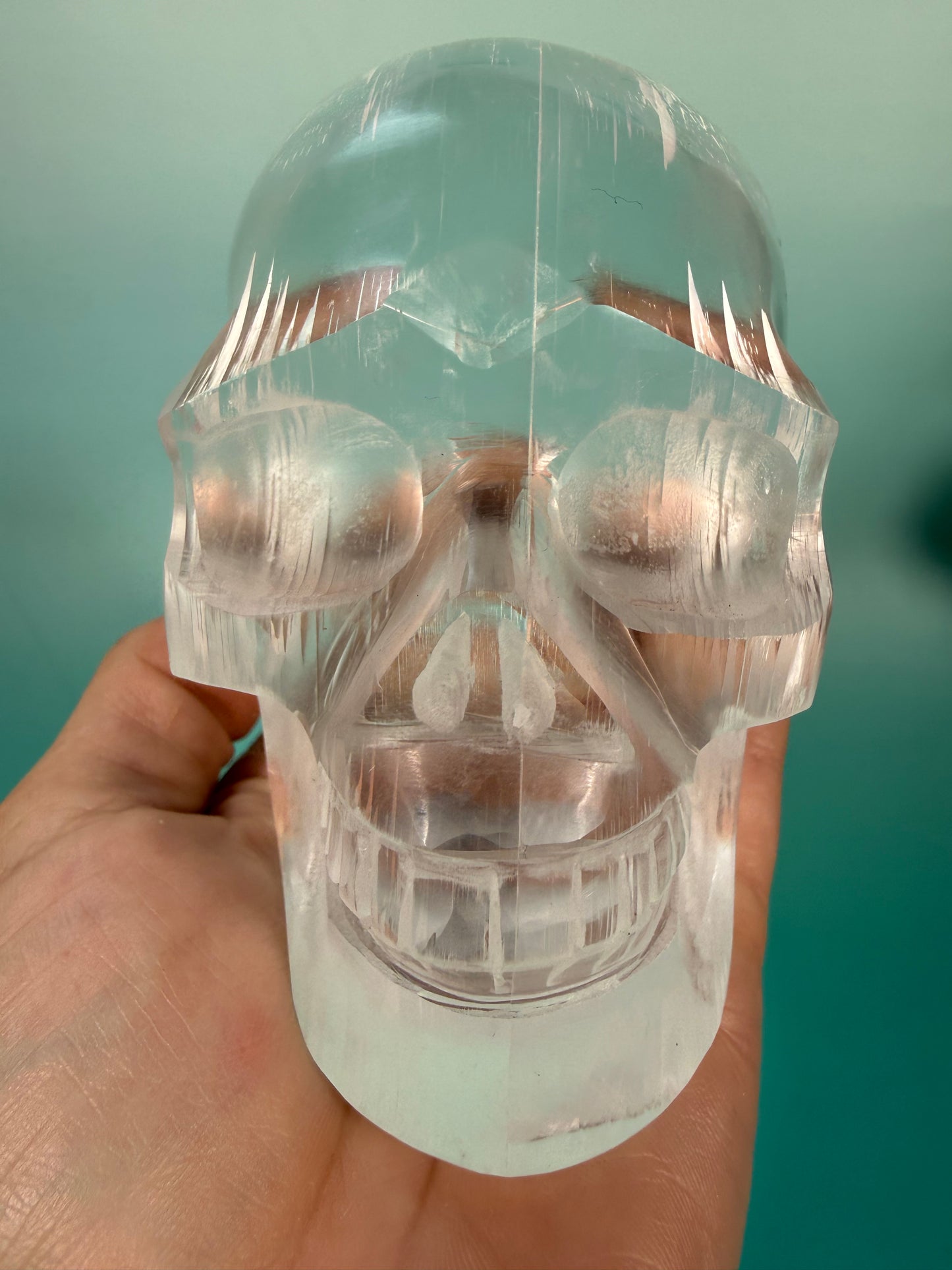 Beautiful satin spar skull carving Q