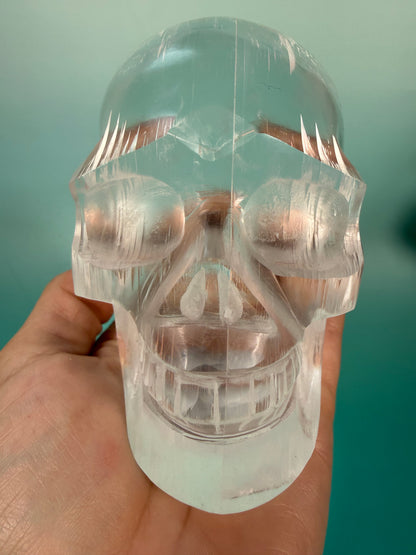 Beautiful satin spar skull carving Q