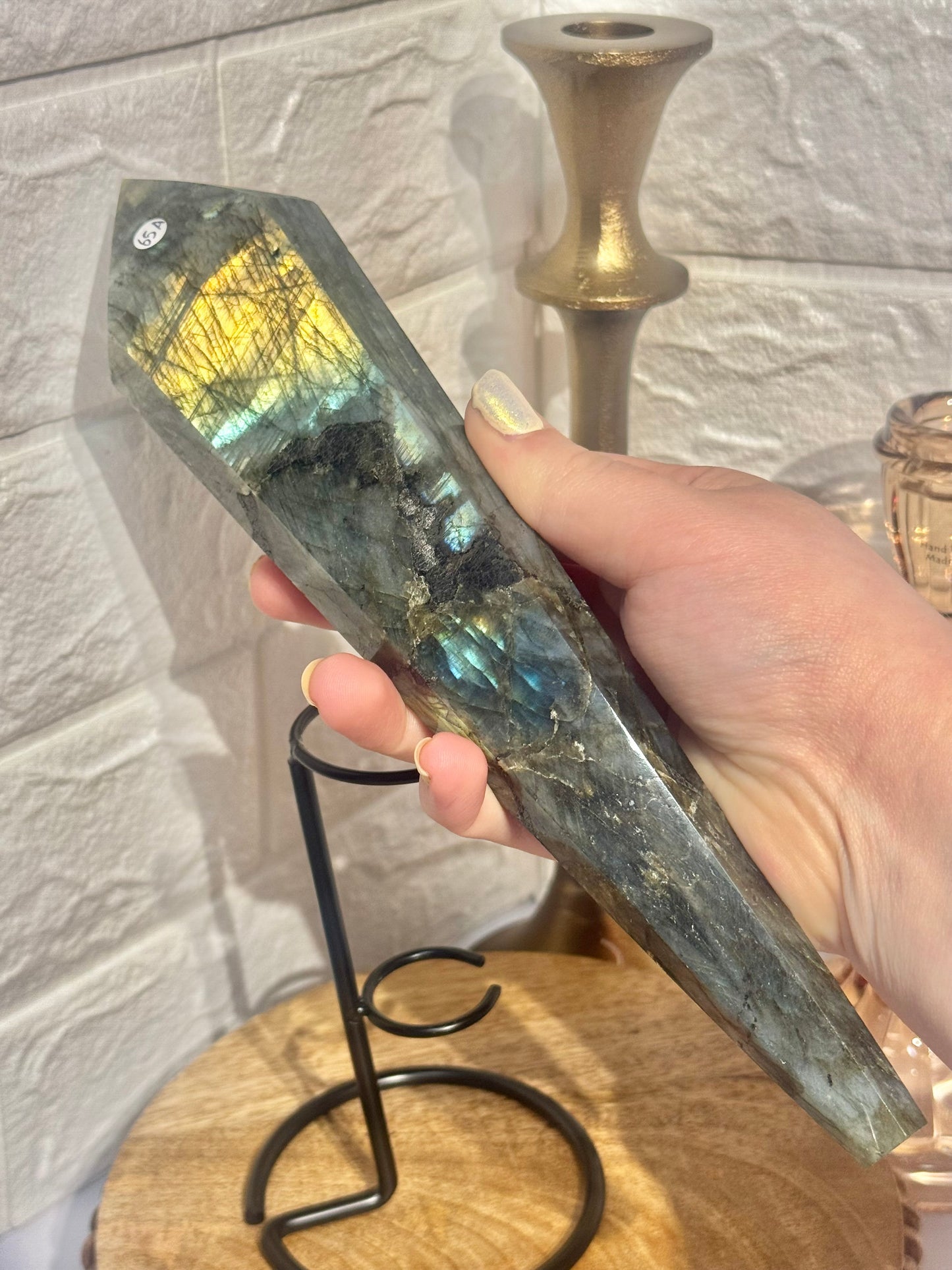 Flashy labradorite wand on custom black stand