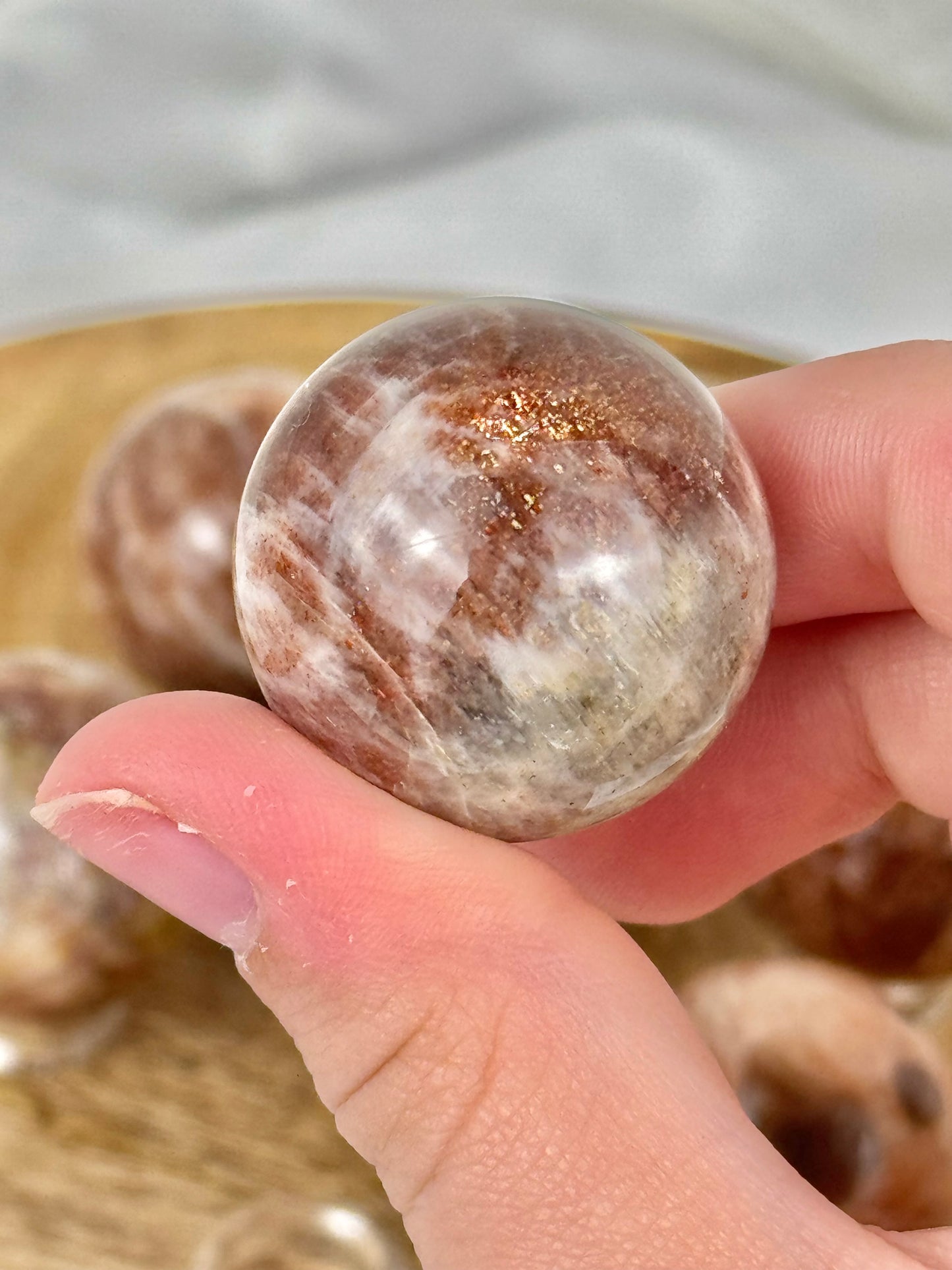 1 flashy sunstone x moonstone sphere from Tanzania