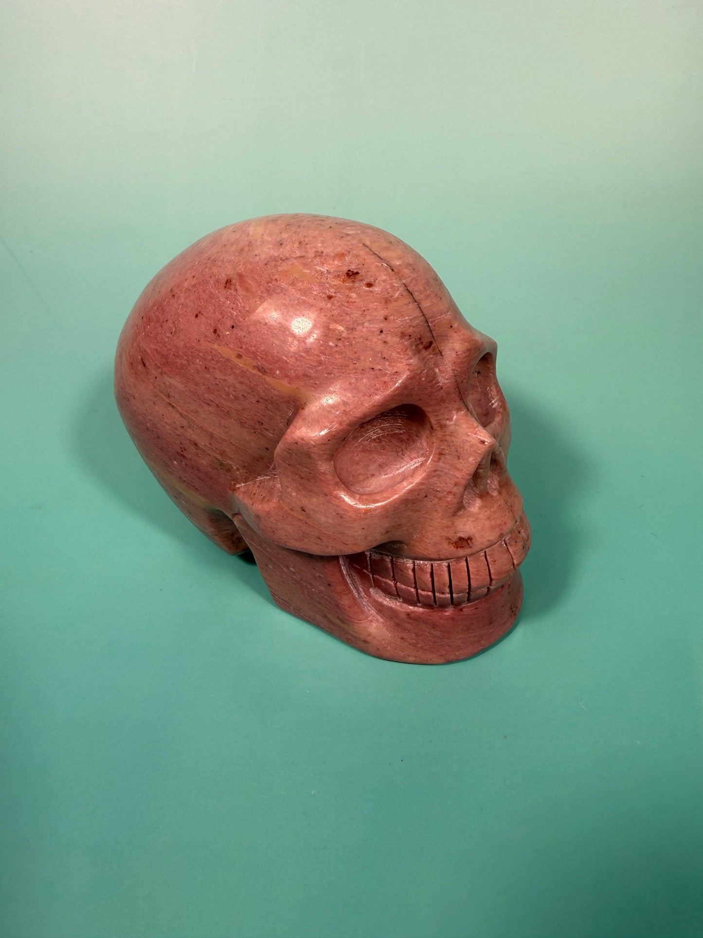 Amazing deep pink rhodonite skull