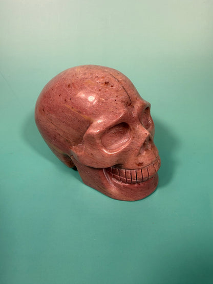 Amazing deep pink rhodonite skull