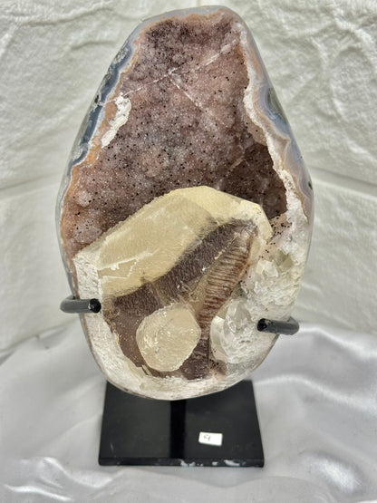 Pink amethyst with calcite on stand from Brazil