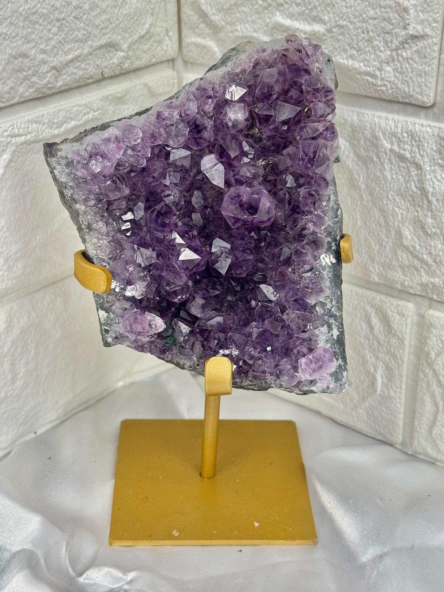 Beautiful amethyst on gold stand from Brazil