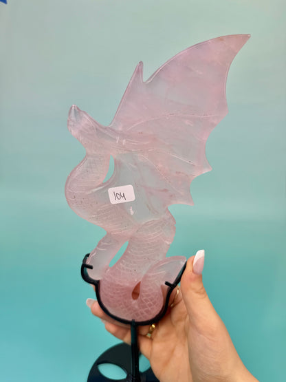 Stunning rose quartz dragon on black stand