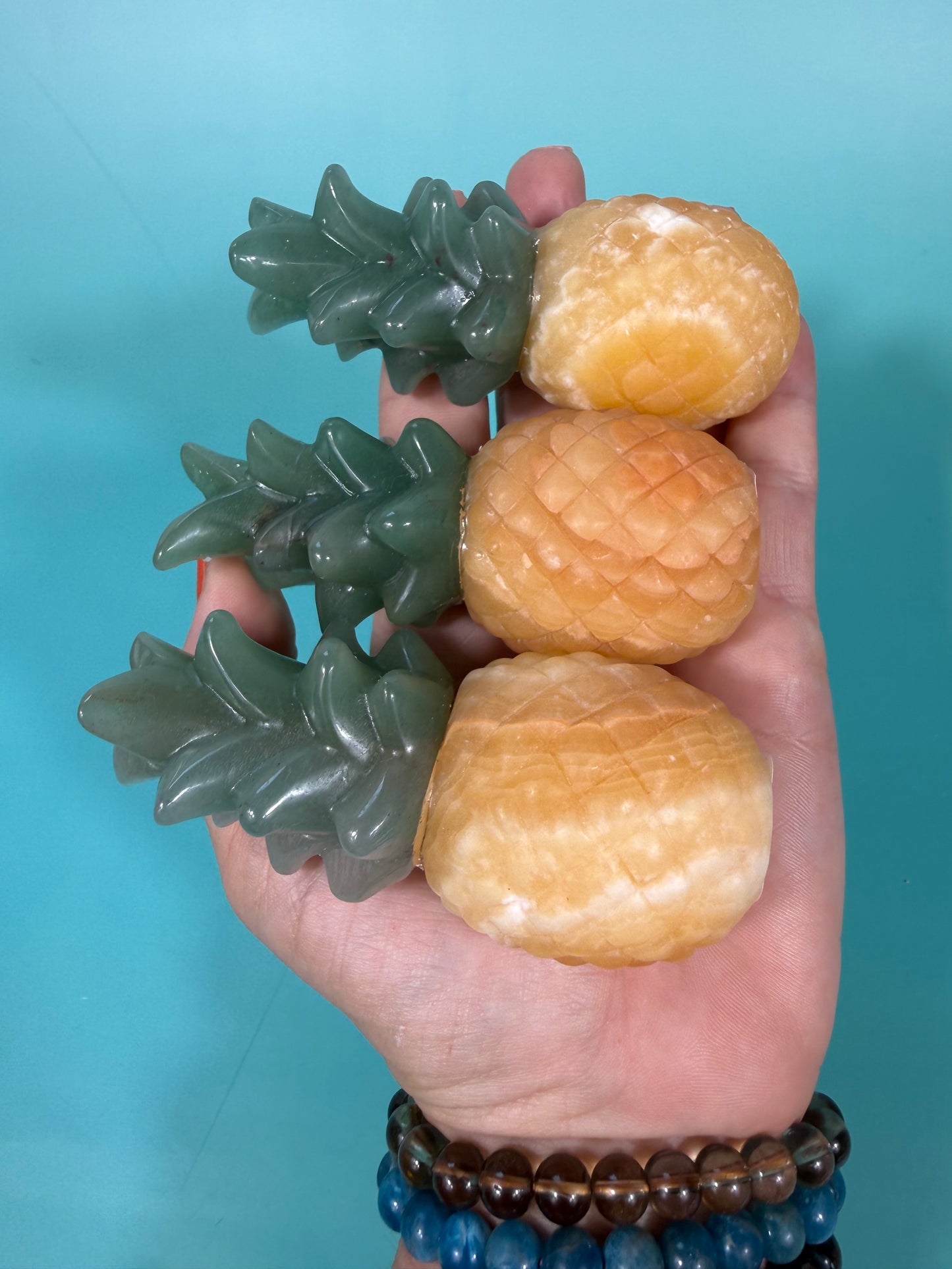 1 Orange calcite, green aventurine pineapple carving
