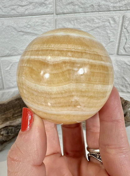 Stunning orange calcite sphere A