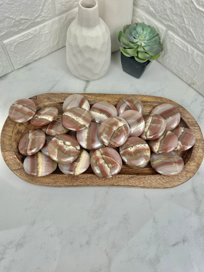 1 pink banded calcite “cookie” flat stone