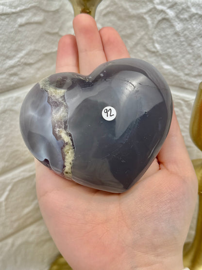 Incredible amethyst heart with calcite on gold stand from Brazil