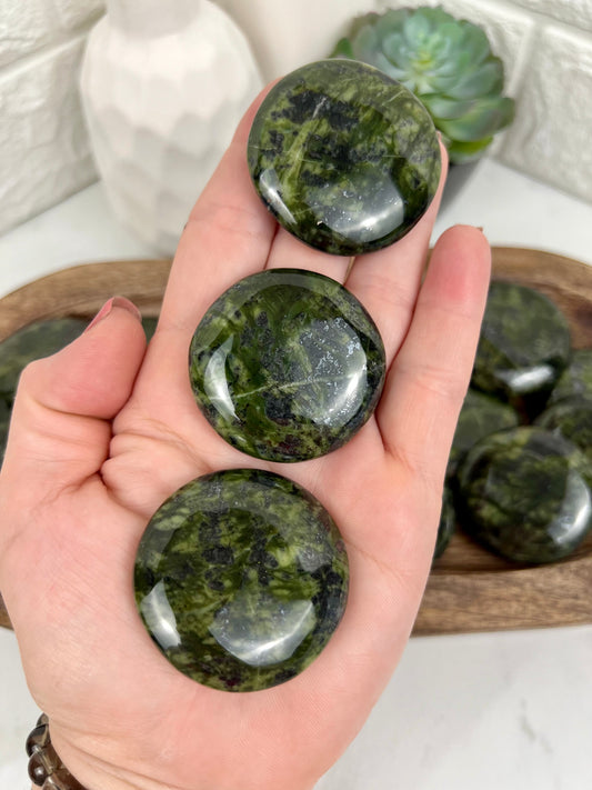 1 dark green serpentine “cookie” flat stone