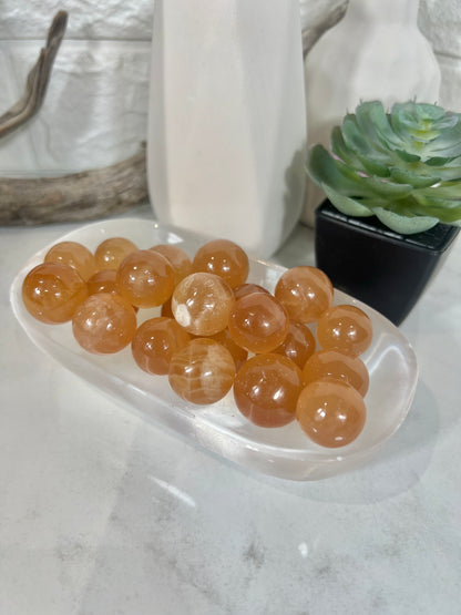 1 juicy honey calcite mini sphere