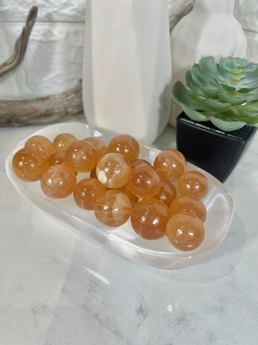 1 juicy honey calcite mini sphere