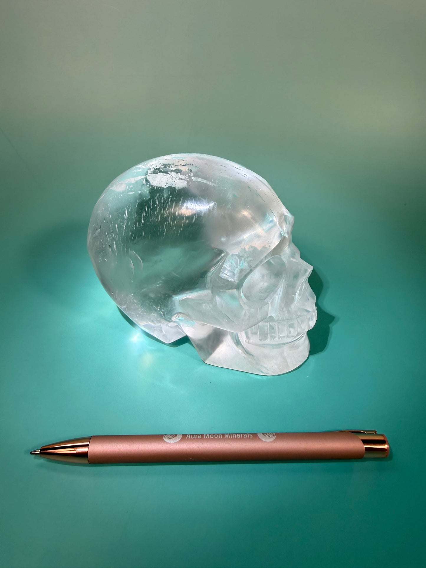 Beautiful satin spar skull carving Q