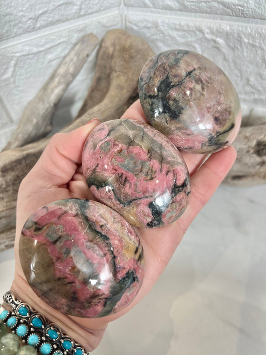 1 pink rhodonite palm stone