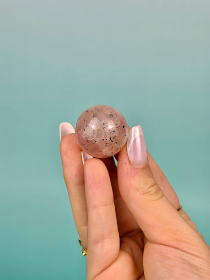 Hematite included flashy rose quartz mini sphere from Brazil