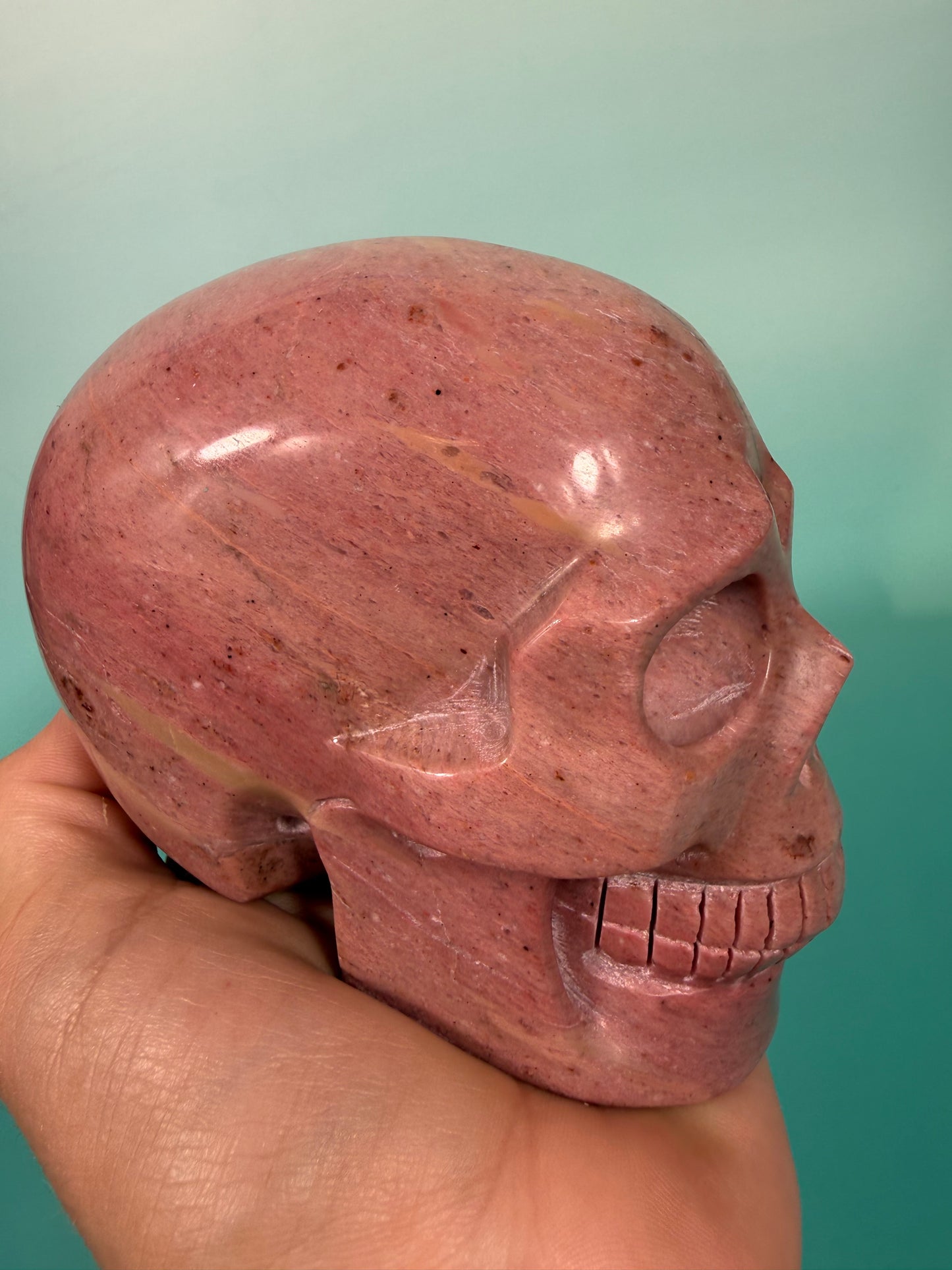 Amazing deep pink rhodonite skull
