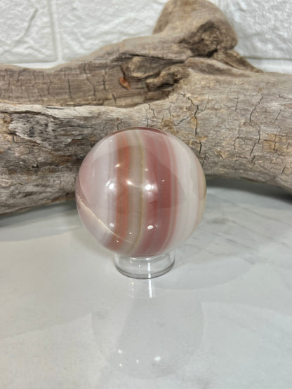 Beautiful pink banded calcite sphere A