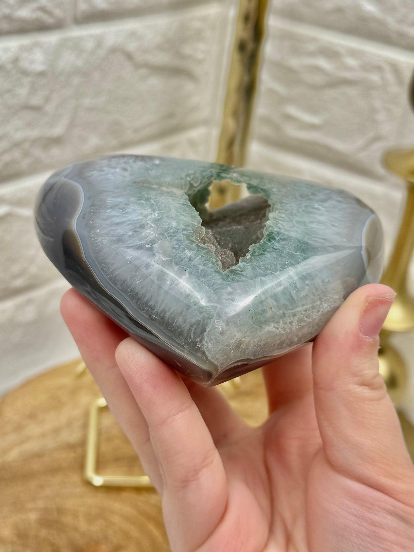 Sugary green amethyst heart on gold stand from Brazil