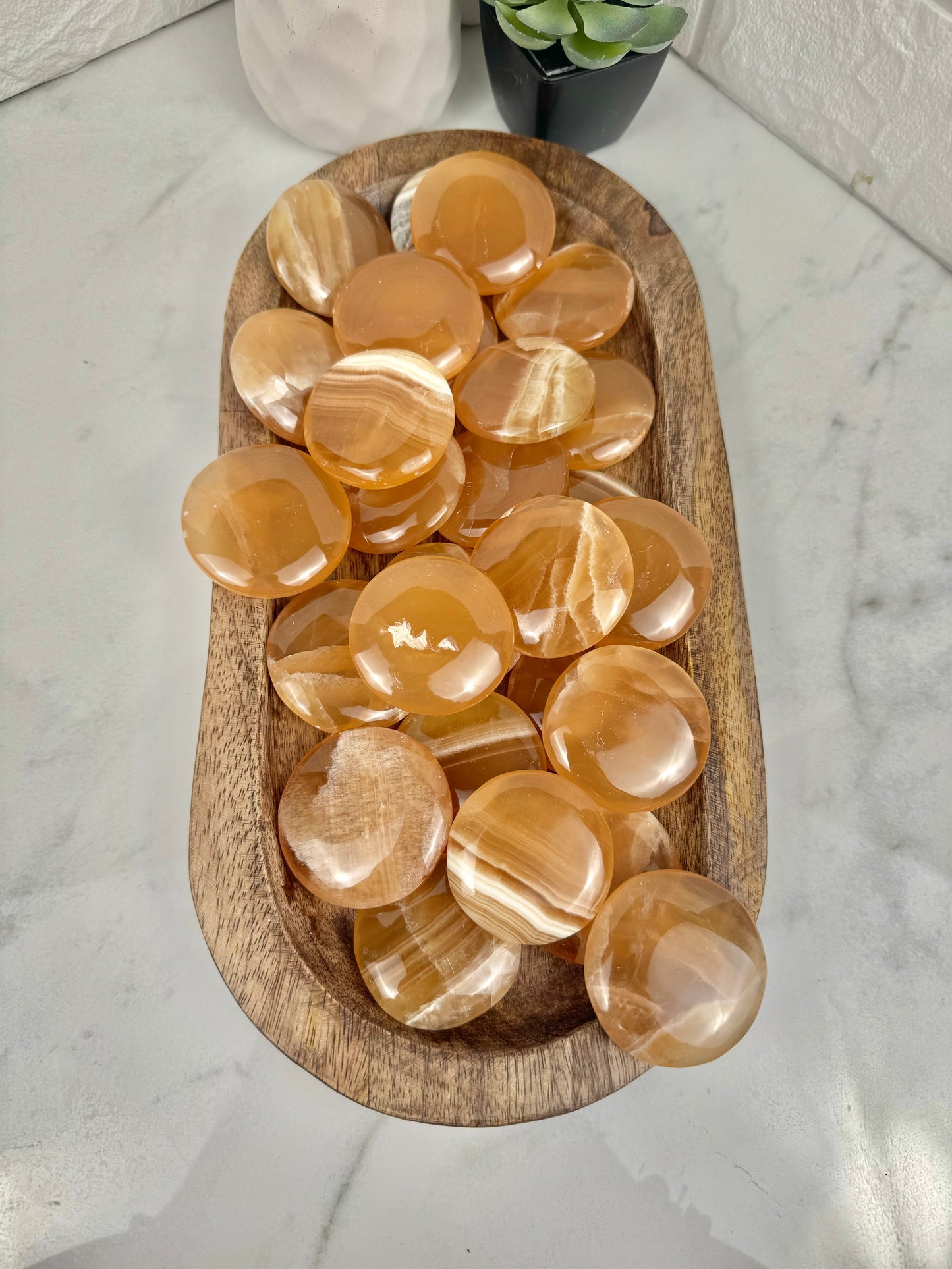 1 honey calcite “cookie” flat stone