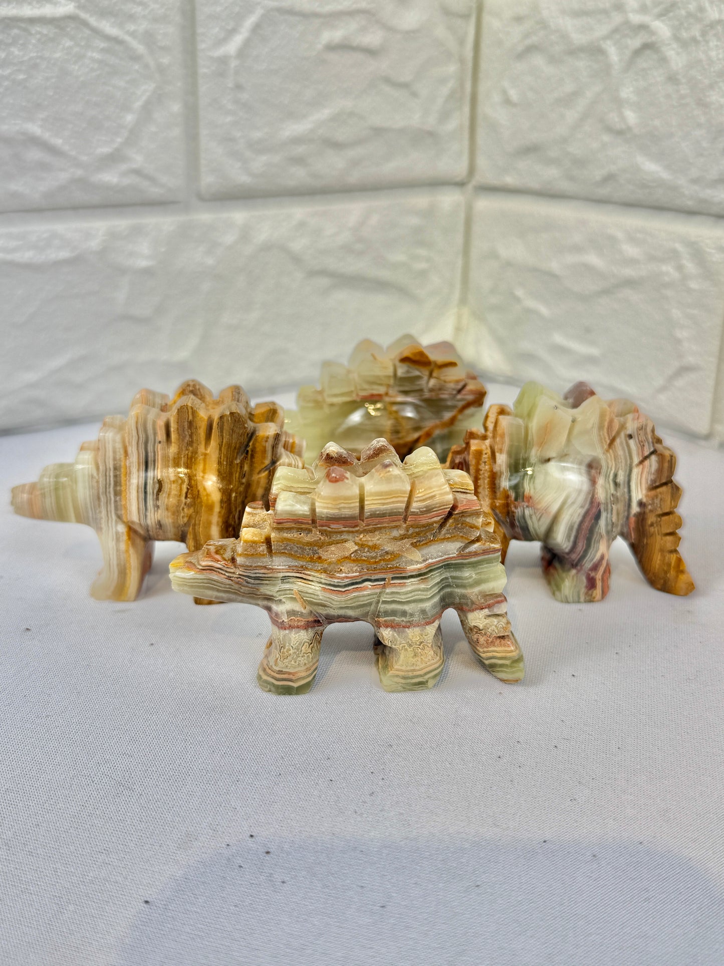 1 green calcite stegosaurus carving