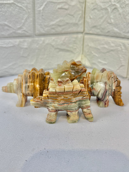 1 green calcite stegosaurus carving