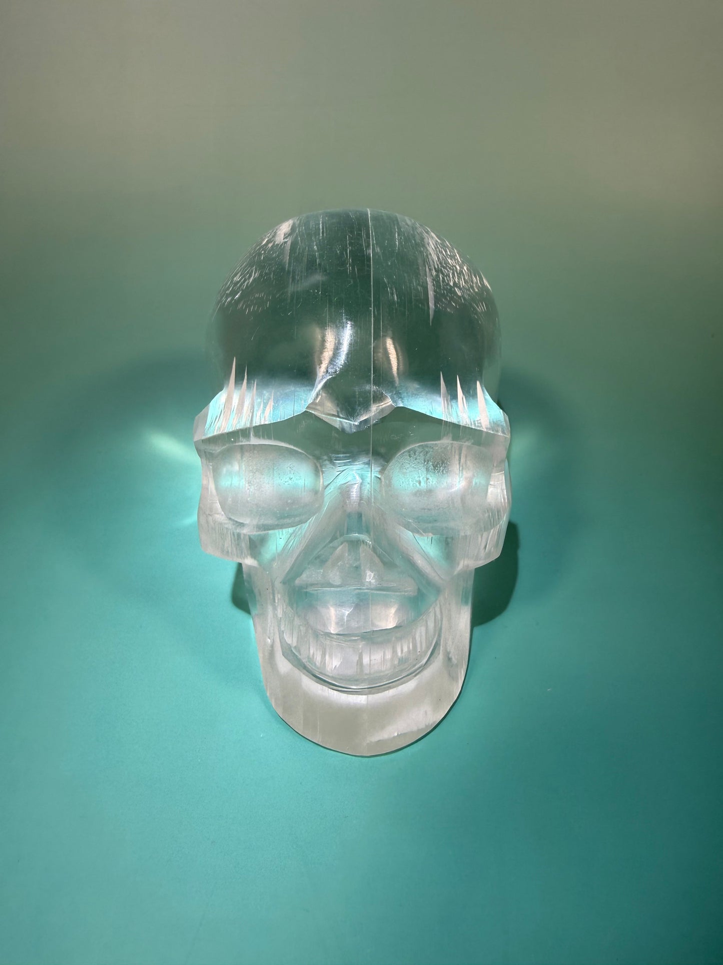 Beautiful satin spar skull carving Q