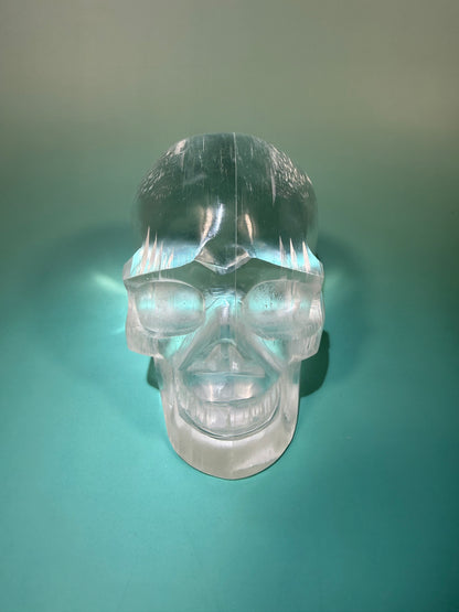 Beautiful satin spar skull carving Q