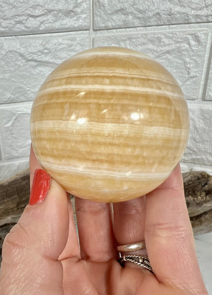 Stunning orange calcite sphere A