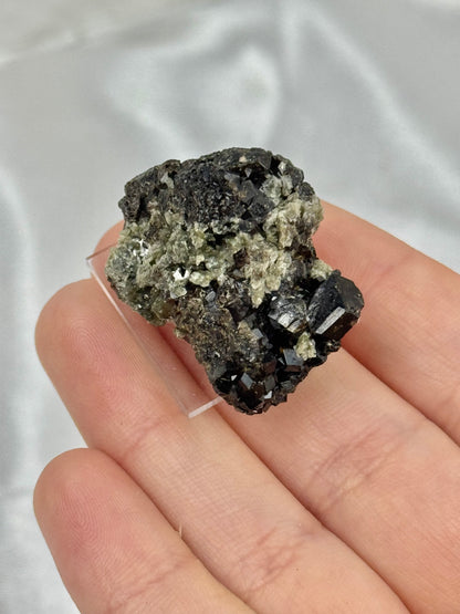 1 black garnet on stand from Mexico