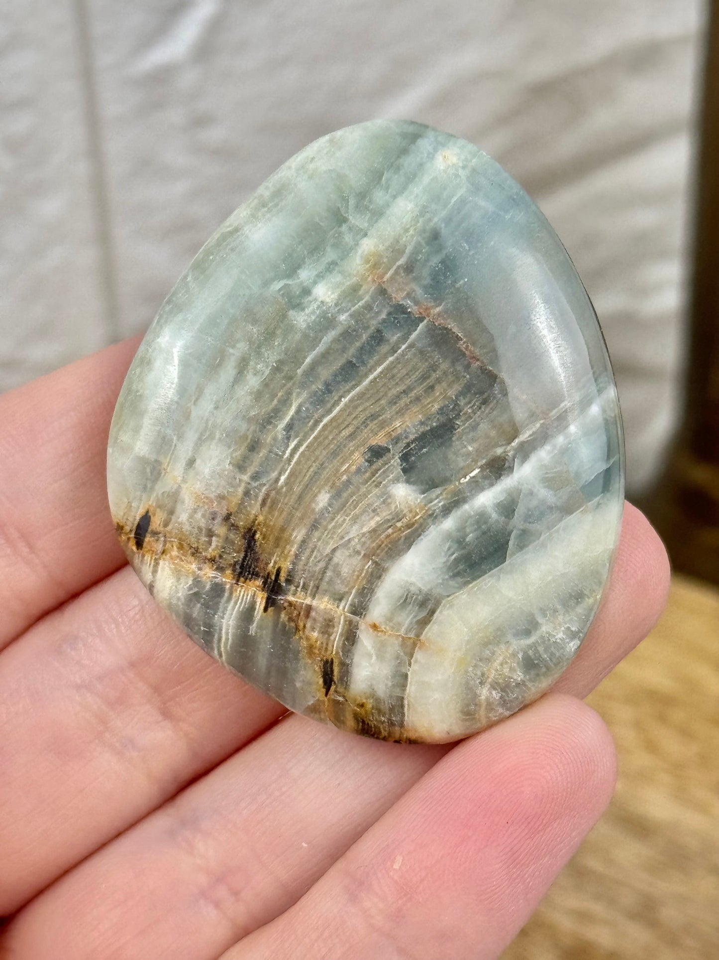 1 blue lemurian aquatine calcite flat cab from Argentina