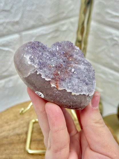 Beautiful lavender amethyst heart with hematite on gold stand from Brazil