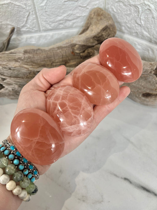 1 strawberry calcite palm stone