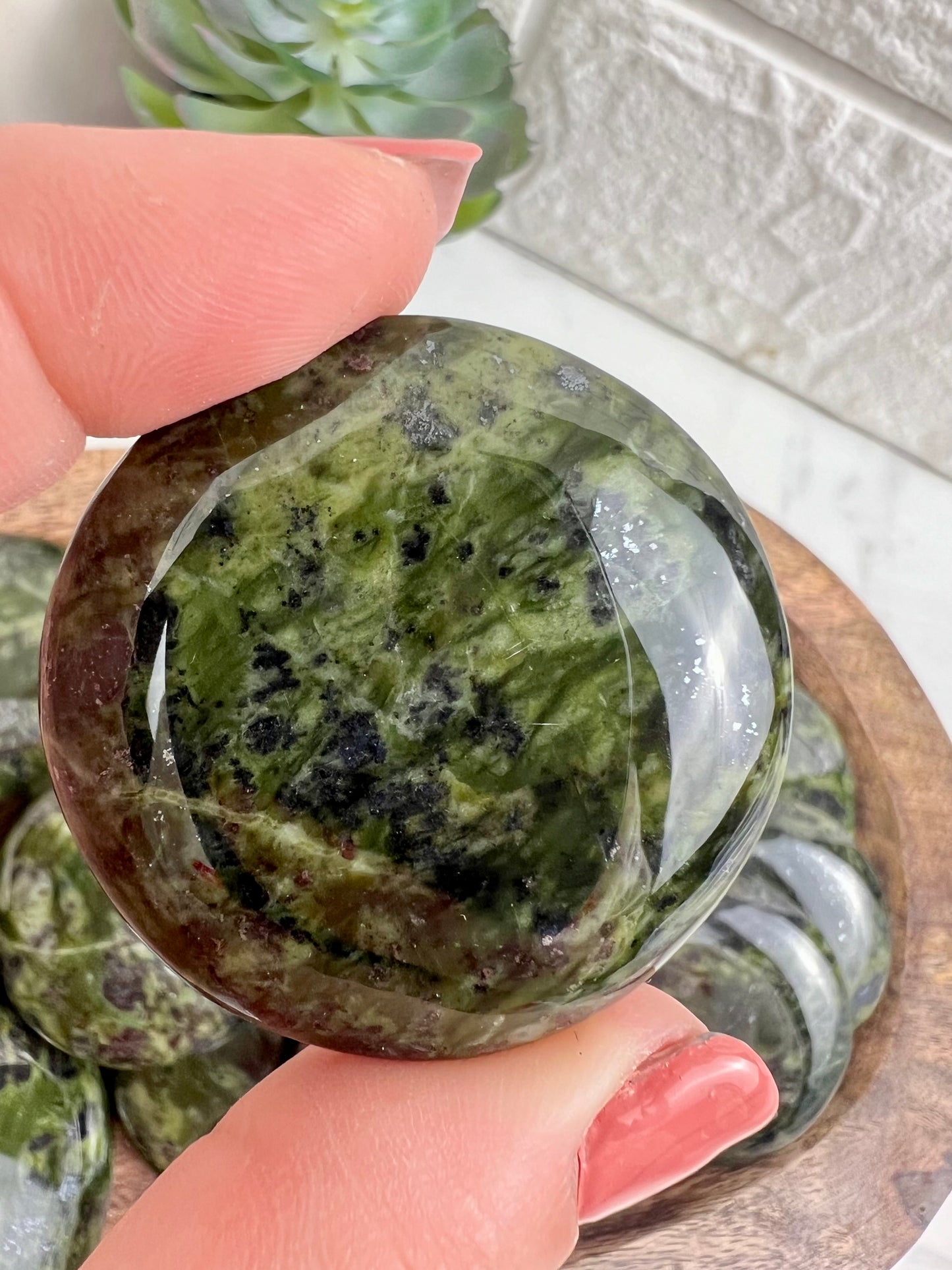 1 dark green serpentine “cookie” flat stone