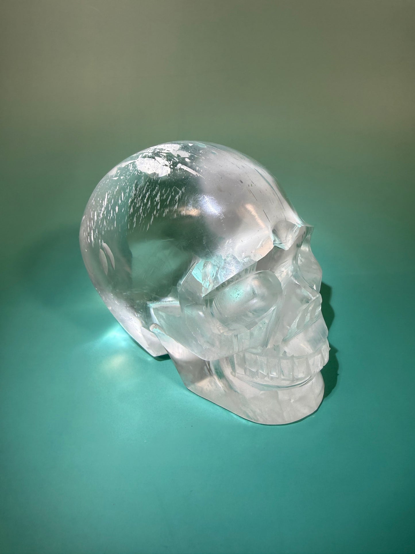 Beautiful satin spar skull carving Q