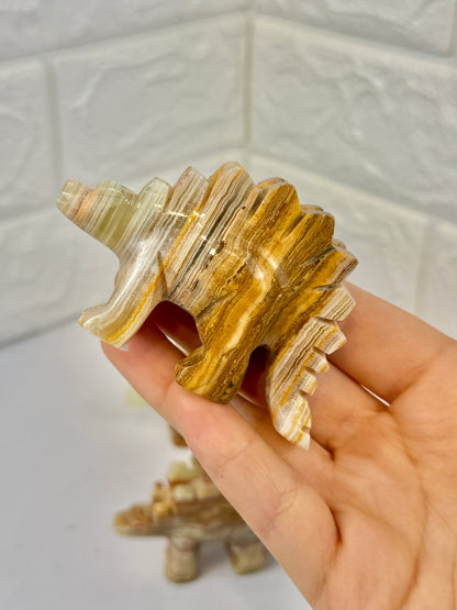 1 green calcite stegosaurus carving