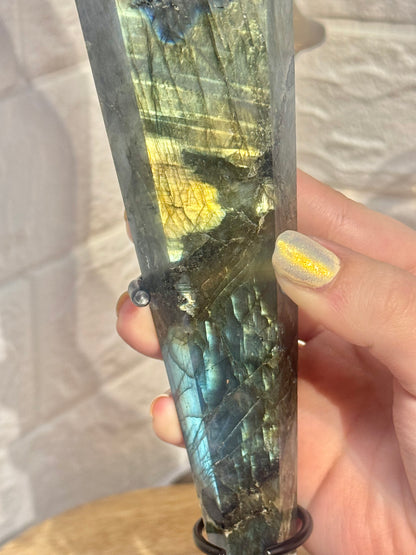 Flashy labradorite wand on custom black stand