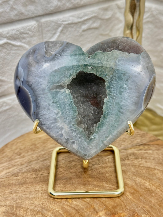 Sugary green amethyst heart on gold stand from Brazil