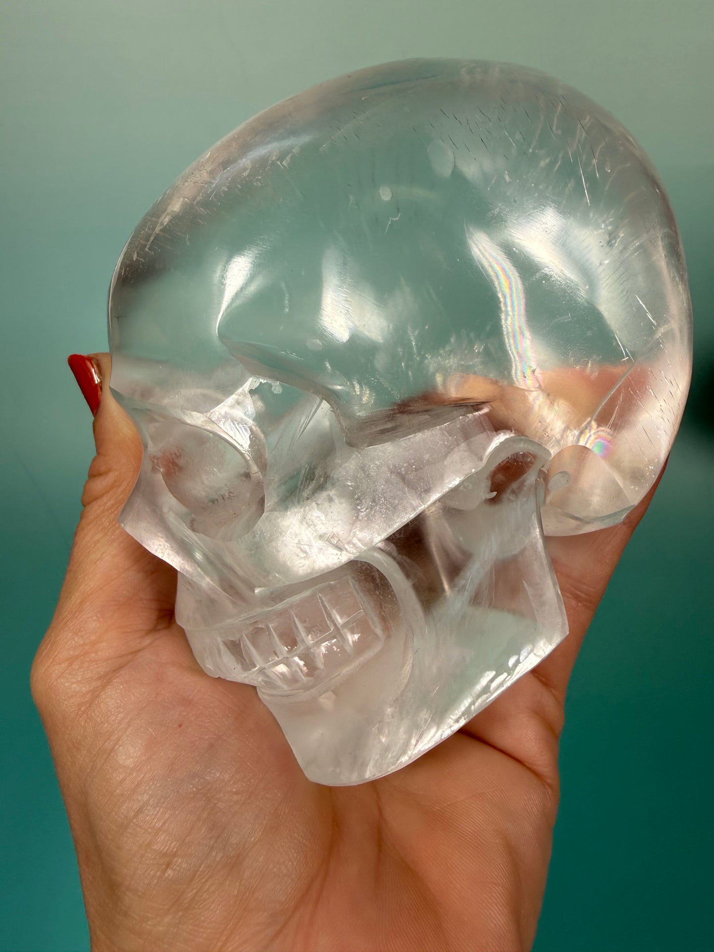 Beautiful satin spar skull carving Q