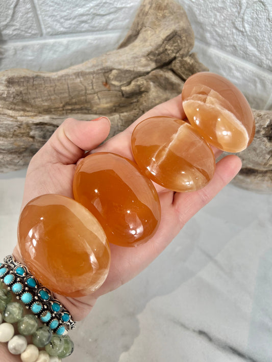 1 stunning honey calcite palm stone