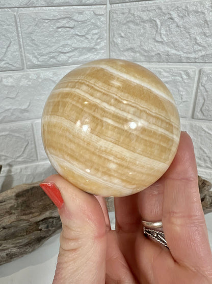 Stunning orange calcite sphere C